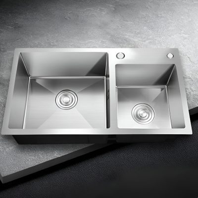 Stainless steel double kitchen sink with two basins, modern design, durable and easy to clean, ideal for residential and commercial kitchens.