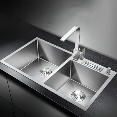 Stainless steel kitchen sink with dual basins and modern faucet, ideal for contemporary kitchens, durable, corrosion-resistant, and easy to clean. Perfect for food prep and dishwashing.