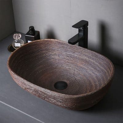 Elegant wooden vessel sink ideal for modern bathroom decor, crafted from natural wood, combines aesthetics and durability, perfect for luxury home renovations or professional spa settings.