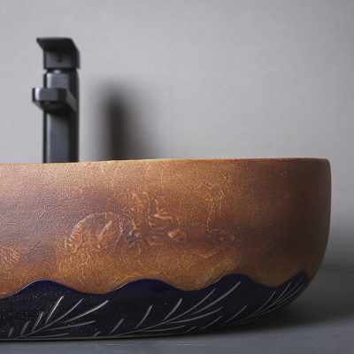 Modern black and brown optical sink with sleek faucet, perfect for stylish eyewear stores or optometry clinics. Durable design enhances the store’s aesthetic and functionality.