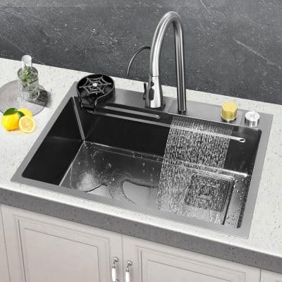 Stainless steel kitchen sink with pull-out faucet, drainboard, and modern design for effective kitchen cleaning.