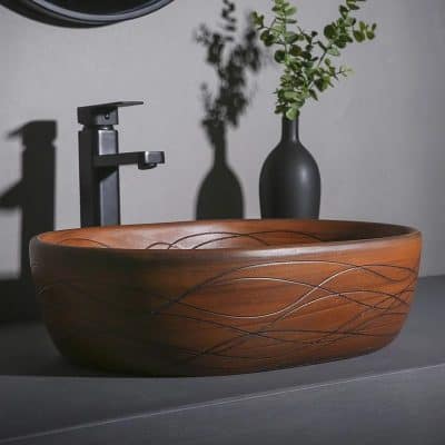 Modern wooden bathroom sink with sleek black faucet and decorative vase, perfect for luxury home decor. Enhance your bathroom with stylish and natural design elements.