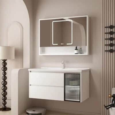 Stylish modern bathroom vanity with mirror, sleek white cabinetry, and a glass-front storage compartment, perfect for elegant bathroom decor.