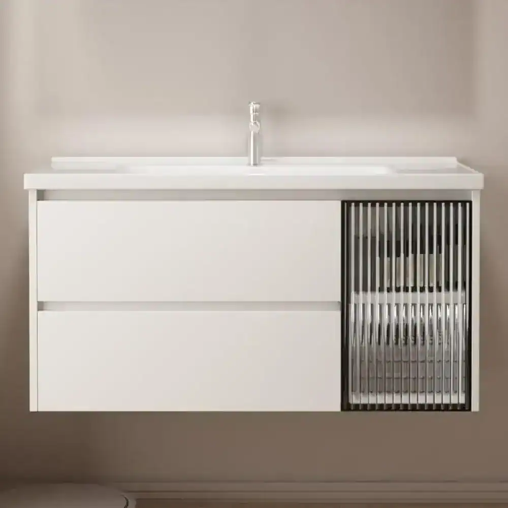 High-quality white bathroom vanity with sleek design, featuring drawer storage and a modern slatted cabinet for organized bathroom essentials. Perfect for contemporary bathrooms.