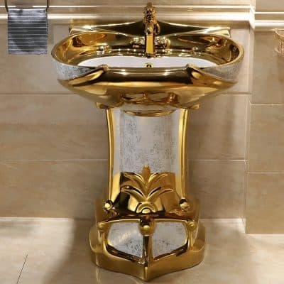 Luxurious gold-toned bathroom sink with ornate design, perfect for upscale medical or spa settings, showcasing premium quality and stylish decor.