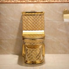 Elegant gold luxury toilet with intricate geometric designs, perfect for upscale bathrooms and modern decor. Enhances aesthetic appeal with a stylish, sophisticated look.