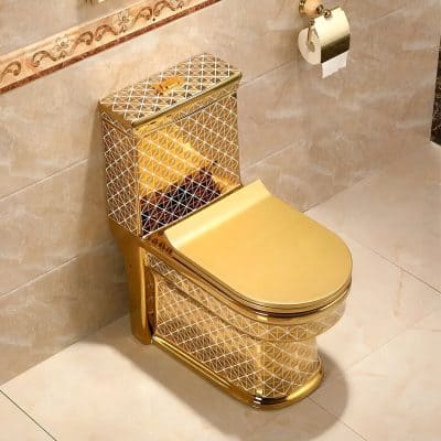 Elegant gold bidet toilet seat with geometric patterns, designed for premium bathroom decor. Combines luxury, hygiene, and style, ideal for upscale homes, hotels, and medical/spa environments emphasizing comfort and sophistication.