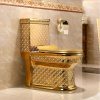 Elegant gold toilet with intricate white geometric detailing, ideal for upscale bathroom decor and luxury hygiene spaces.