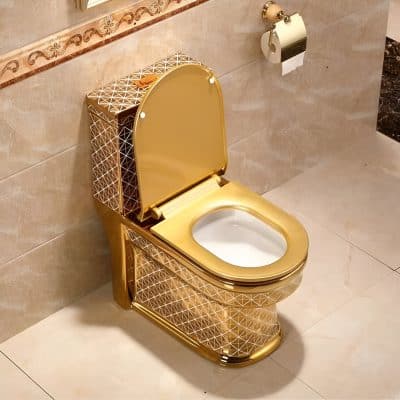 Elegant gold-plated toilet with geometric pattern and modern style, perfect for upscale bathrooms and opt clinics seeking luxury aesthetics.