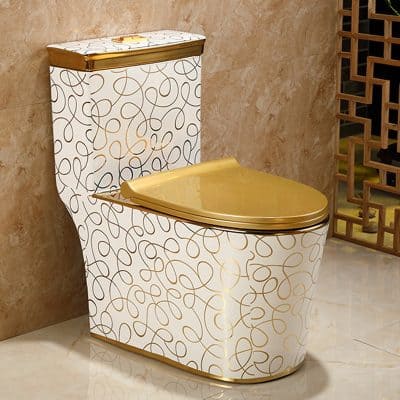 Luxurious gold toilet with stylish swirl pattern, ideal for high-end modern bathrooms and interior design.