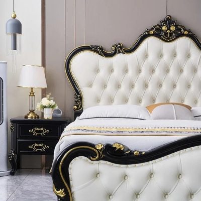 Luxurious bedroom furniture with a regal black and gold ornate bed frame, matching nightstand, and sophisticated decor, perfect for upscale home interiors.