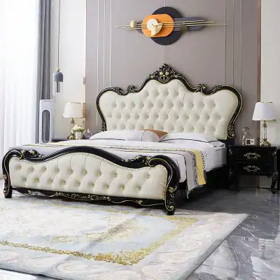 Elegant king-sized bed with ornate black and gold detailing, plush tufted upholstery, perfect for luxury bedroom decor.