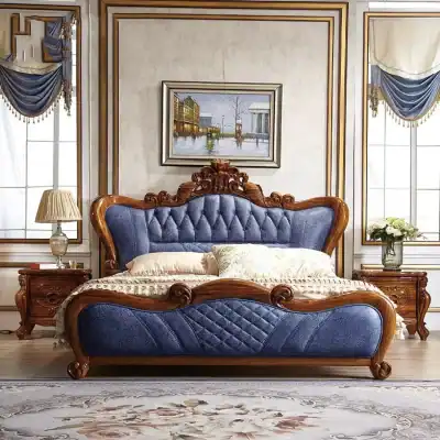 Luxurious blue velvet and wooden bedroom set with ornate carved details, perfect for upscale bedrooms, offering comfort and style with high-quality craftsmanship.