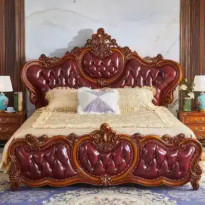 Luxurious vintage bed with carved wooden details and rich red leather upholstery, perfect for a classic bedroom aesthetic. Features an ornate headboard and footboard design.