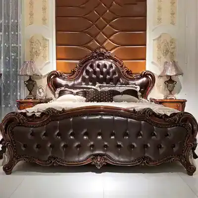 Elegant leather bed with ornate wooden frame and tufted headboard, perfect for luxury bedroom decor and comfort.