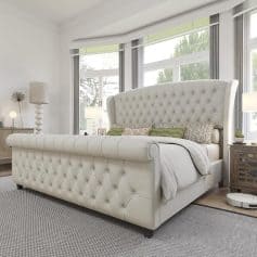 Luxurious white tufted bed with high headboard, in a contemporary bedroom with large windows, cozy decor, ideal for premium bedroom furniture selection.