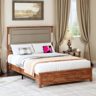 Bright bedroom featuring a stylish wooden bed with a beige upholstered headboard, cozy bedding, and sleek furniture, perfect for a comfortable and luxurious sleep environment.