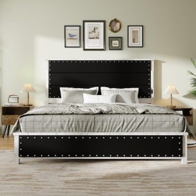 Luxurious black and white bed frame with studded detailing, complemented by crisp white bedding and modern decor. Ideal for stylish interior design and bedroom furniture enthusiasts seeking quality and elegance.