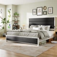 Elegant modern bed with black upholstered headboard and footboard, stylish decor, and natural light in a cozy bedroom setting.