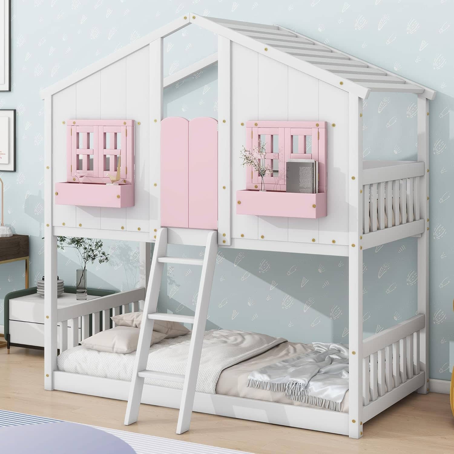 A charming white and pink kids' bedhouse with a ladder, designed for children’s bedrooms, combining playfulness and comfort. Perfect for adventurous little ones who love cozy, imaginative spaces.