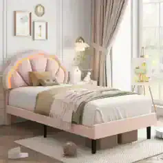 Bright and stylish kids bedroom interior featuring pastel pink bed with unique headboard, charming artwork, cozy textiles, and playful decor, creating a cozy, inviting space for children that combines comfort with whimsical design.