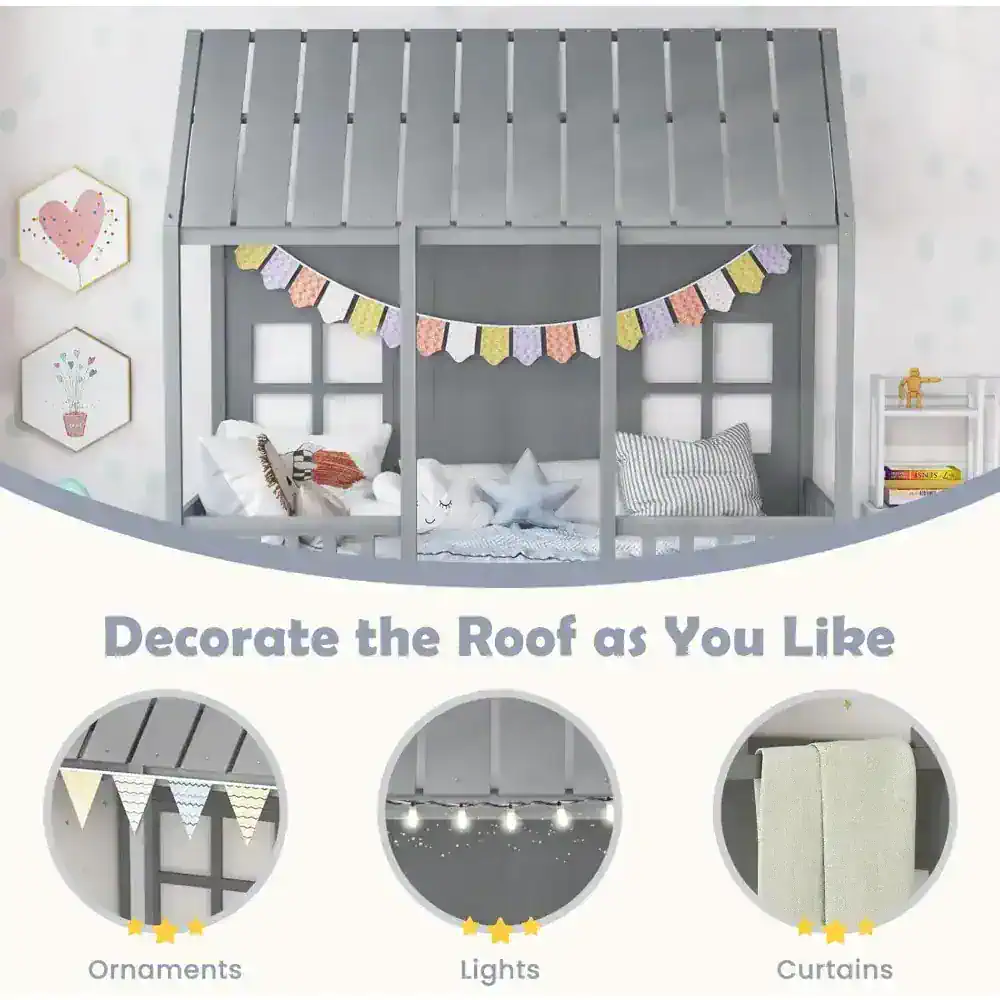 Cute children’s bed with house-shaped roof, colorful garland, and cozy bedding in a playful nursery decorated with wall art. Perfect for fun, cozy sleep space.