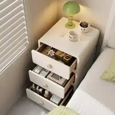 Opt for stylish bedroom nightstands with drawers to organize your space, featuring a nightlamp, mug, and decorative accessories for a cozy, functional bedroom look.