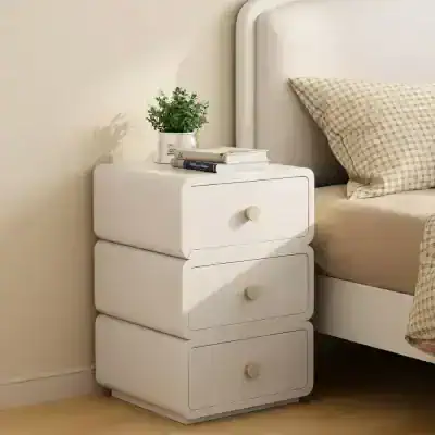 Modern white bedroom nightstand with three drawers, minimalist design, and round wooden knobs. Perfect for bedroom storage and style in cozy bedrooms.