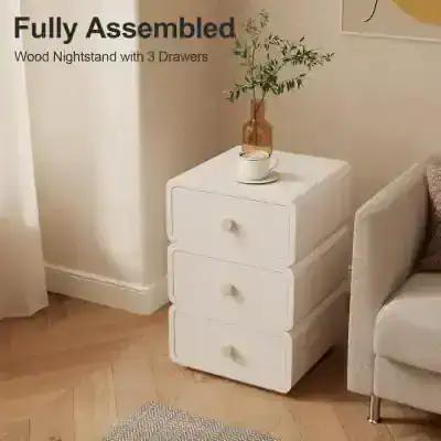A sleek, white wooden nightstand with three drawers, perfect for bedroom storage and decor. It features a modern design, ideal for enhancing your bedroom's aesthetic with functional furniture.