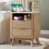 Elegant wood nightstand with drawers, ideal for bedroom organization and style enhancement.