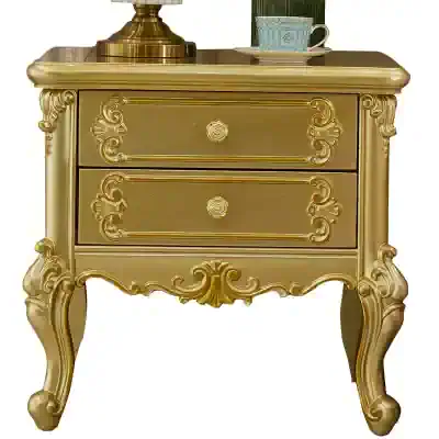 Luxury gold nightstand with intricate carved details, perfect for elegant bedroom decor. Adds a touch of sophistication and vintage charm to your space.