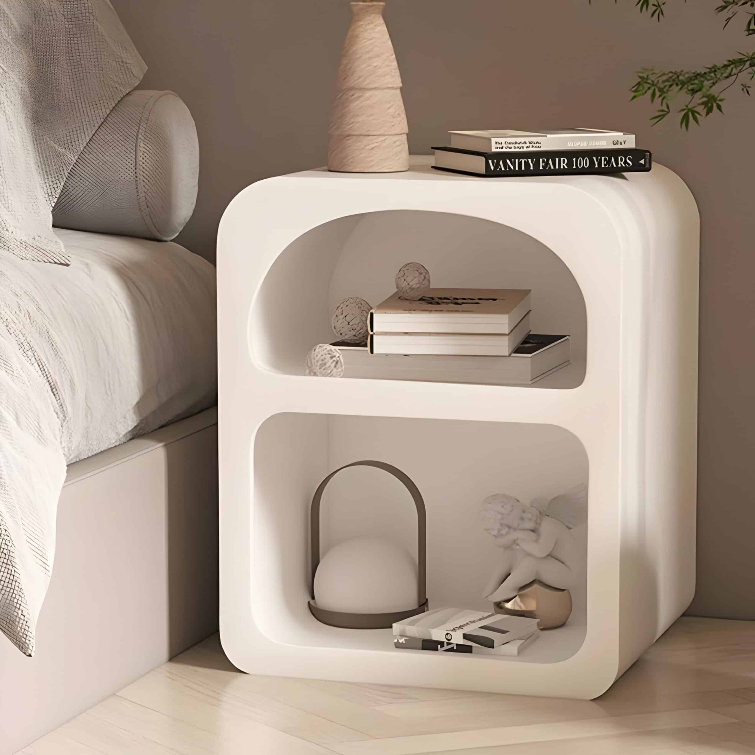 Contemporary white bedside table ideal for storing eye care products, books, and decorative items in a modern bedroom setting.