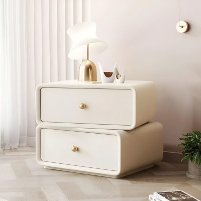 Stylish white modern nightstand with gold accents, minimalist design, perfect for cozy bedroom interiors, featuring a contemporary table lamp and decorative vases, ideal for opt store ambiance.
