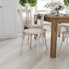 Elegant dining table with white wooden chairs, perfect for home and restaurant decor. Features a natural wood finish, stylish and durable for everyday use, enhancing your dining space.