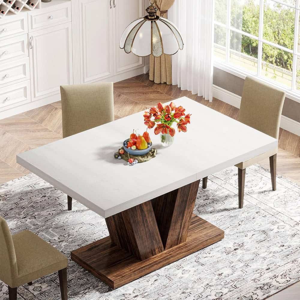 Modern dining table with beige chairs, bright room with large windows, and decorative centerpiece, ideal for home dining, family gatherings, and stylish interior design.