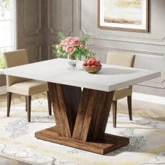 Elegant dining room with a contemporary white tabletop and unique wooden V-shaped base, perfect for stylish home décor and gatherings.