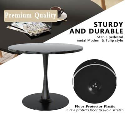 Modern black pedestal table with durable metal tulip-style design for home or office decor. Perfect for adding sleek, sturdy furniture to any space.