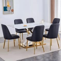 Stylish monochrome dining table with luxurious black chairs and gold details, perfect for contemporary interior design and upscale dining experiences.