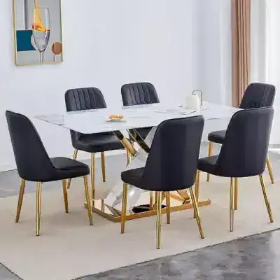 Elegant dining room set featuring black upholstered chairs with tufted backs, a white marble table with gold geometric legs, perfect for contemporary interiors.