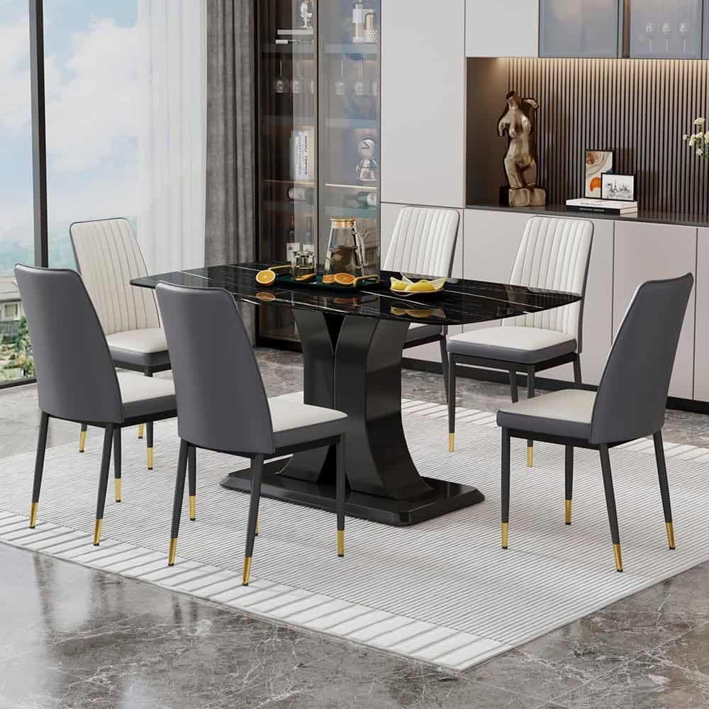 Stylish modern dining table and chairs for elegant home or office dining areas. Sleek black marble top with comfortable upholstered seats, perfect for gatherings and special occasions.