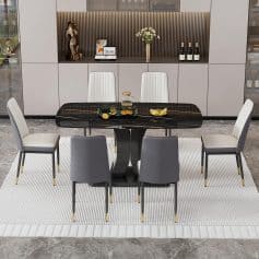 Luxurious dining area with a black marble table, white and gray upholstered chairs, and tasteful decor, showcasing a chic and modern ambiance ideal for upscale homes and interior design inspiration.
