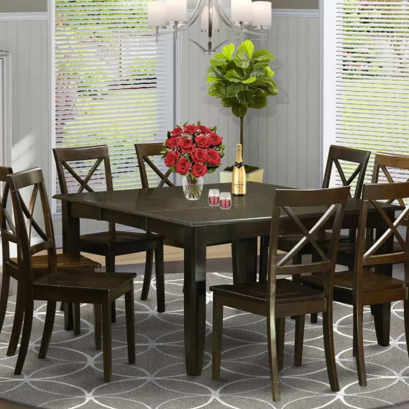 Image featuring a sophisticated dining room with dark wood table, stylish chairs, and decorative elements, ideal for showcasing Monalisa Store's premium optical and eyewear collection in a cozy, inviting environment.