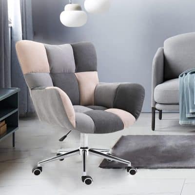 A chic, multi-tone upholstered office chair with a high backrest, swivel base, and caster wheels, perfect for ergonomic work in a modern medical or professional environment.