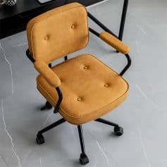 Stylish tan office chair with cushioned seat and backrest, adjustable armrests, and wheels for mobility, ideal for modern office or medical clinic environments.