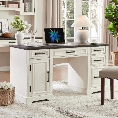 White office desk with a dark-colored top, featuring multiple drawers and cabinet space, perfect for organizing your workspace efficiently.
