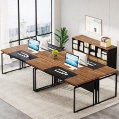 A sleek, contemporary office setup featuring four Apple iMac computers on a wooden desk, ideal for collaborative workspaces and professional environments in the optometry or healthcare industry.