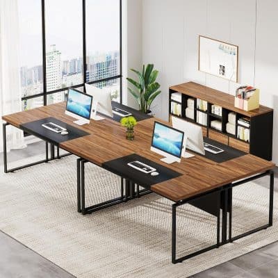 A sleek, contemporary office setup featuring four Apple iMac computers on a wooden desk, ideal for collaborative workspaces and professional environments in the optometry or healthcare industry.