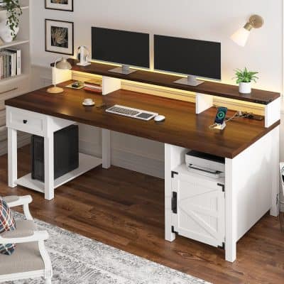 A stylish home office desk featuring dual monitors, a spacious wooden surface, and organized accessories. Ideal for enhancing productivity in a modern, comfortable workspace setting.