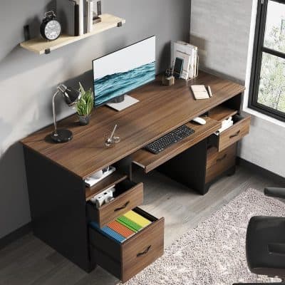 Stylish office desk featuring a sleek computer monitor, ergonomic keyboard, desk lamp, and organized drawers, perfect for a productive workspace in a contemporary home or office setting.
