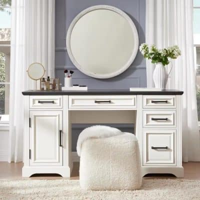 Style-conscious vanity with spacious drawers, a large circular mirror, and chic accessories for the perfect beauty station.